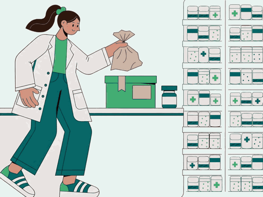 Pharmacist handing over a prescription bag at the counter